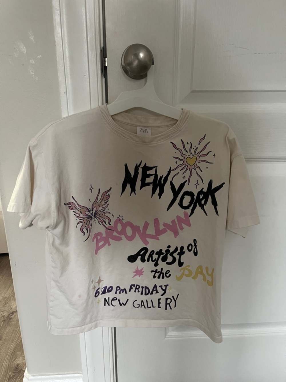 Zara Cream Graphic Crewneck Tee with Black and Pink Accents